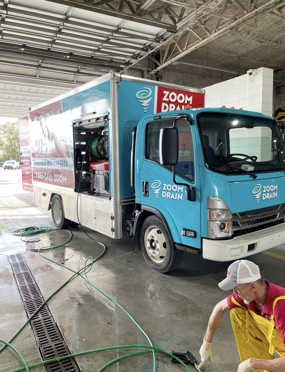 Image of Zoom Drain Employee and Zoom Drain truck
